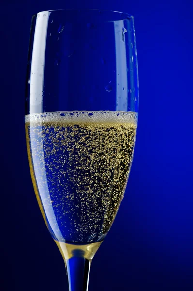 Champagne glasses on blue close up — Stock Photo, Image