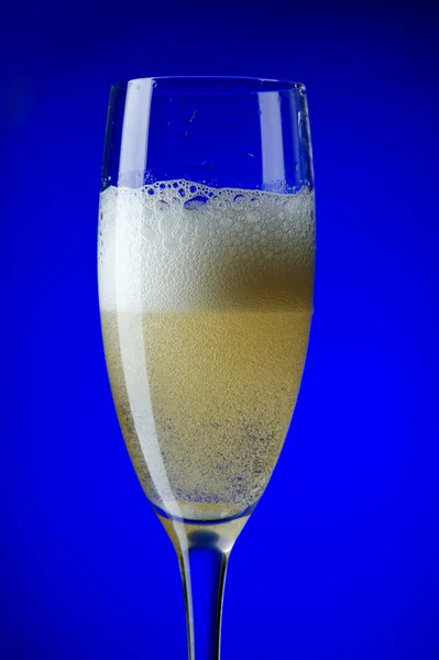 Champagne glasses on blue closeup — Stock Photo, Image