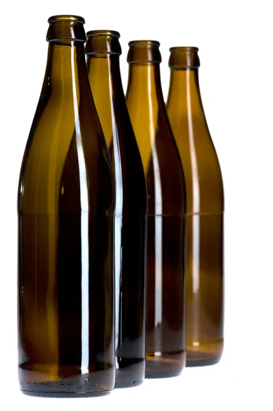 Prázdné pivní láhev na bílém pozadí — Stock fotografie