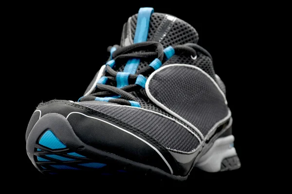 Sport shoes on black — Stock Photo, Image