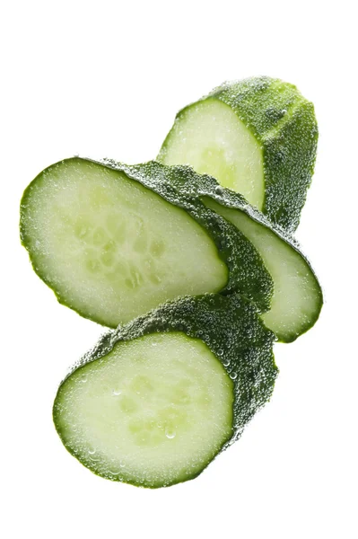 Cutting cucumber in water closeup — Stock Photo, Image