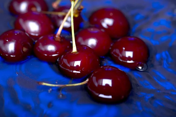 Cherry on blue close up — Stock Photo, Image