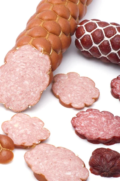 Cutting sausage on white background — Stock Photo, Image