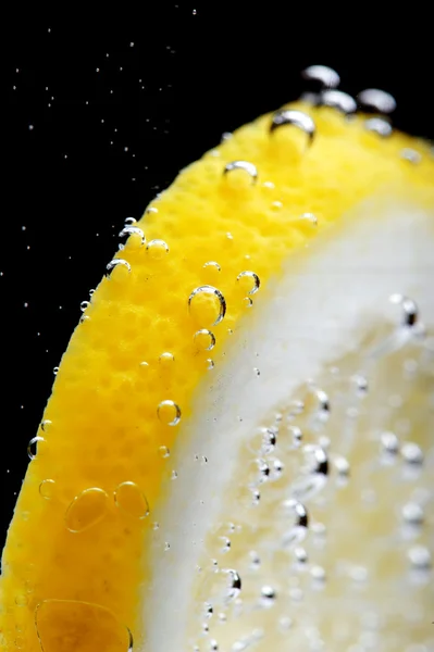 Lemon in water — Stock Photo, Image