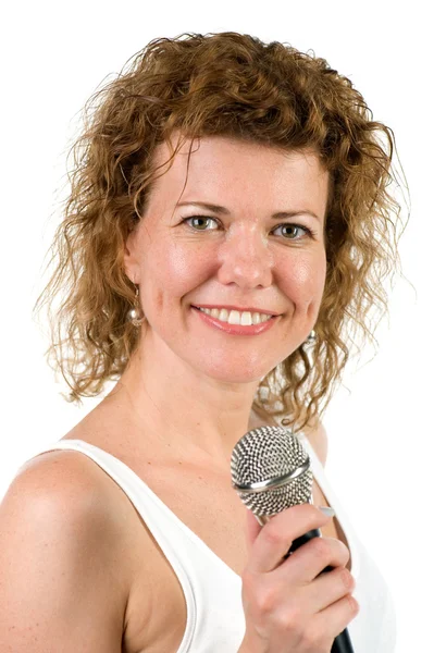 Woman with microphone on white — Stock Photo, Image