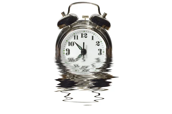 Alarm clock in water — Stock Photo, Image