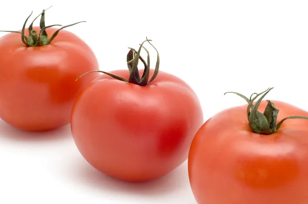 Tre tomat på nära håll — Stockfoto