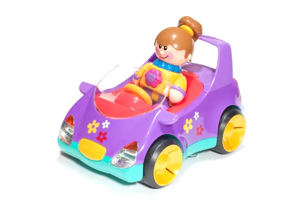 Speelgoed meisje en auto — Stockfoto