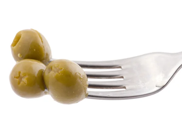Green olive on fork — Stock Photo, Image