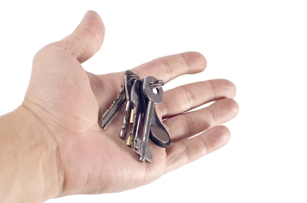 Key on hand on white — Stock Photo, Image