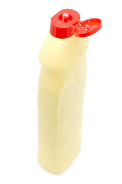 Открытая жёлтая пластиковая бутылка — стоковое фото