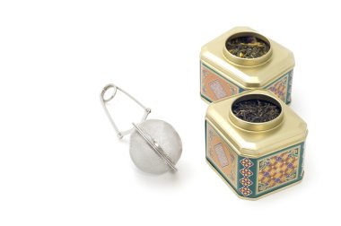 Tea-strainer with tea box clipart