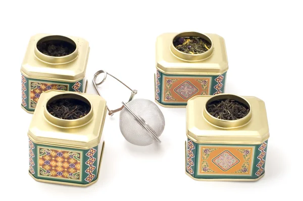 Tea boxes with strainer — Stock Photo, Image