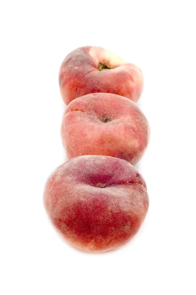 Три персика крупным планом — стоковое фото