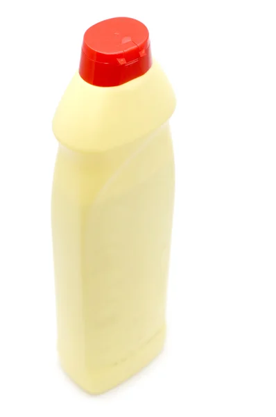 Желтая пластиковая бутылка — стоковое фото
