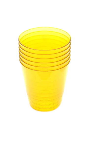 Yellow plastic cups — Stock Photo, Image