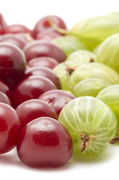 Cherries with gooseberry closeup — Stock Photo, Image