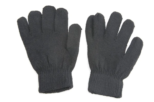Schwarze Handschuhe auf weißem Grund — Stockfoto