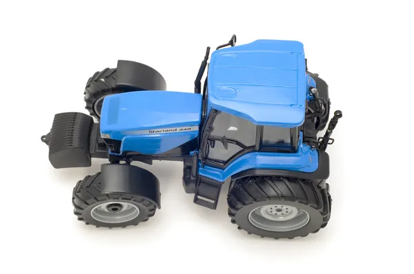 Синяя тракторная игрушка — стоковое фото