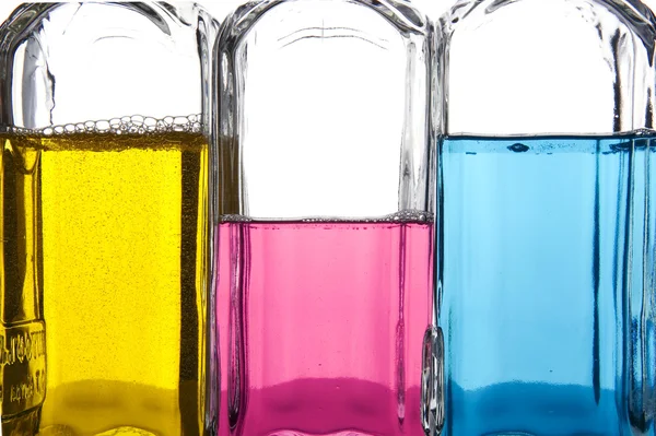 Botella de color con líquido de cerca —  Fotos de Stock