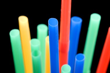 Drinking straw on black macro clipart