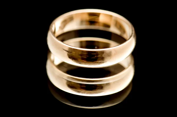 Gold ring on black macro — Stock Photo, Image