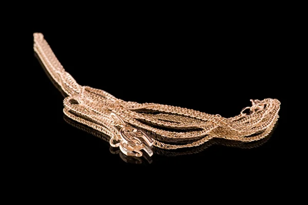 Golden chain and scorpion closeup — Stock Photo, Image