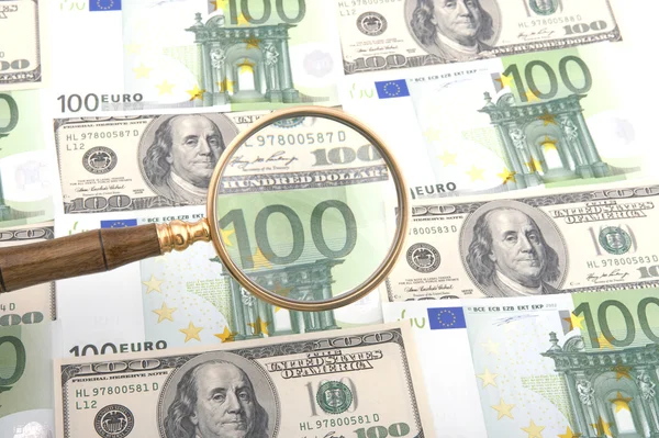Magnifier with money — Stock Photo, Image