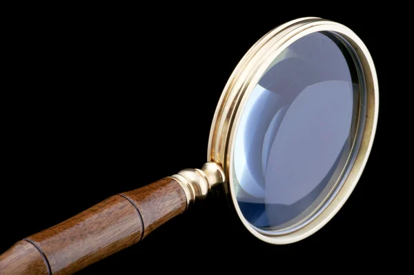Magnifying glass on black close up — Stock Photo, Image