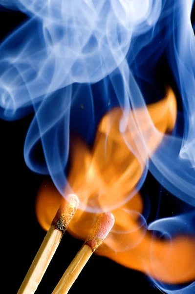 Match on fire on black — Stock Photo, Image
