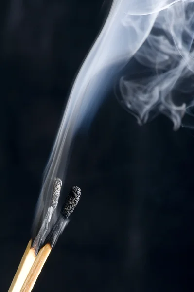 Match with smoke on black background — Stock Photo, Image