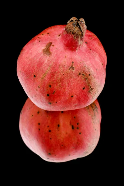 Pomegranate on black macro — Stock Photo, Image