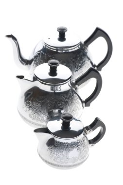 Three metal teapot on white clipart
