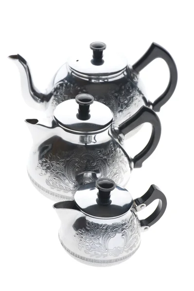 Beyaz üzerine üç metal çaydanlık — Stok fotoğraf