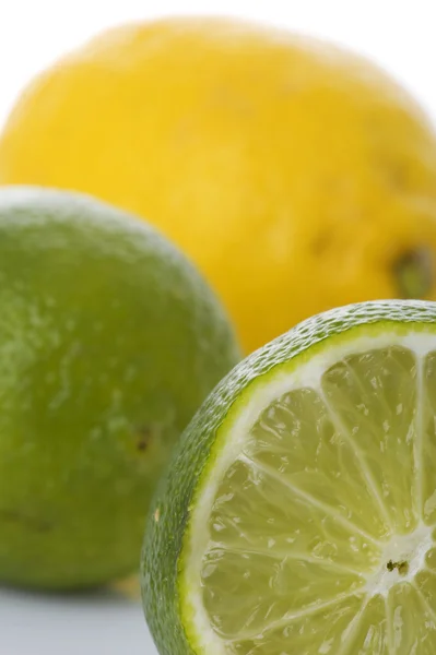 Lime and lemon on white macro — Stock Photo, Image