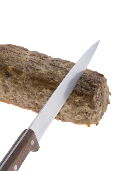 Domuz sosisi ve bıçak — Stok fotoğraf