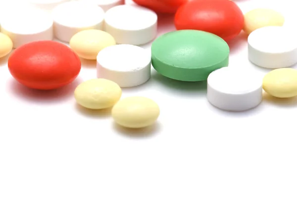 Comprimidos de farmacia en macro blanco —  Fotos de Stock