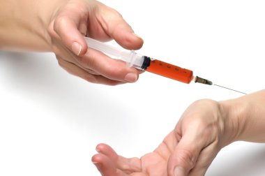 Syringe on hand closeup clipart