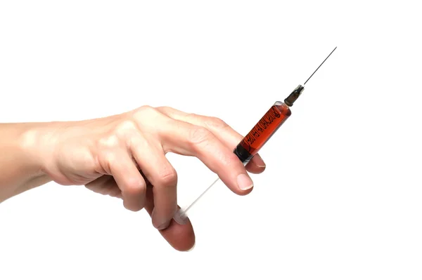 Syringe on hand Stock Picture