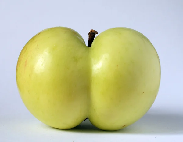 Apple of a funny shape — Stock Photo, Image