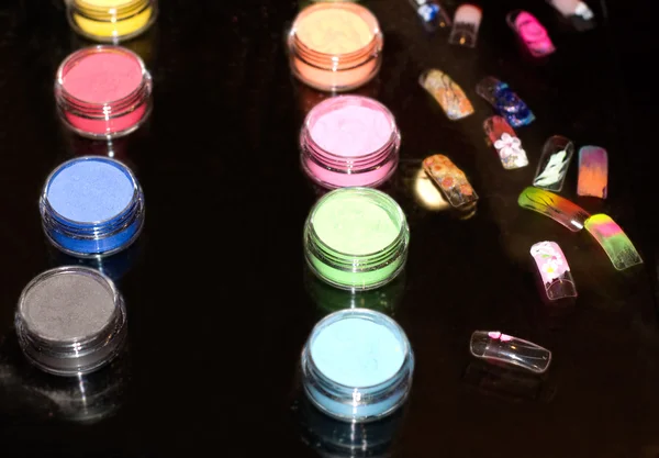 Set of powder cosmetic and fake nails — Stock Photo, Image