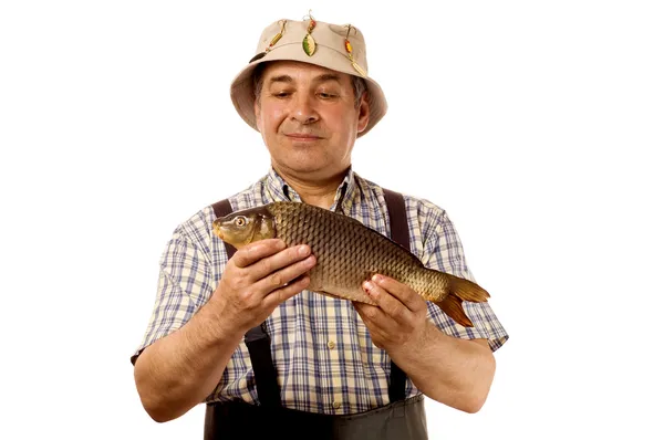 Senior Fischer mit seinem Fang — Stockfoto