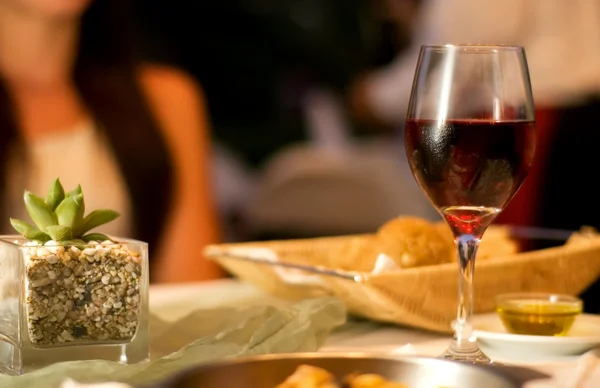 Served table with red wine at restaurant — Stock Photo, Image