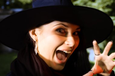 Screaming witch in hat clipart