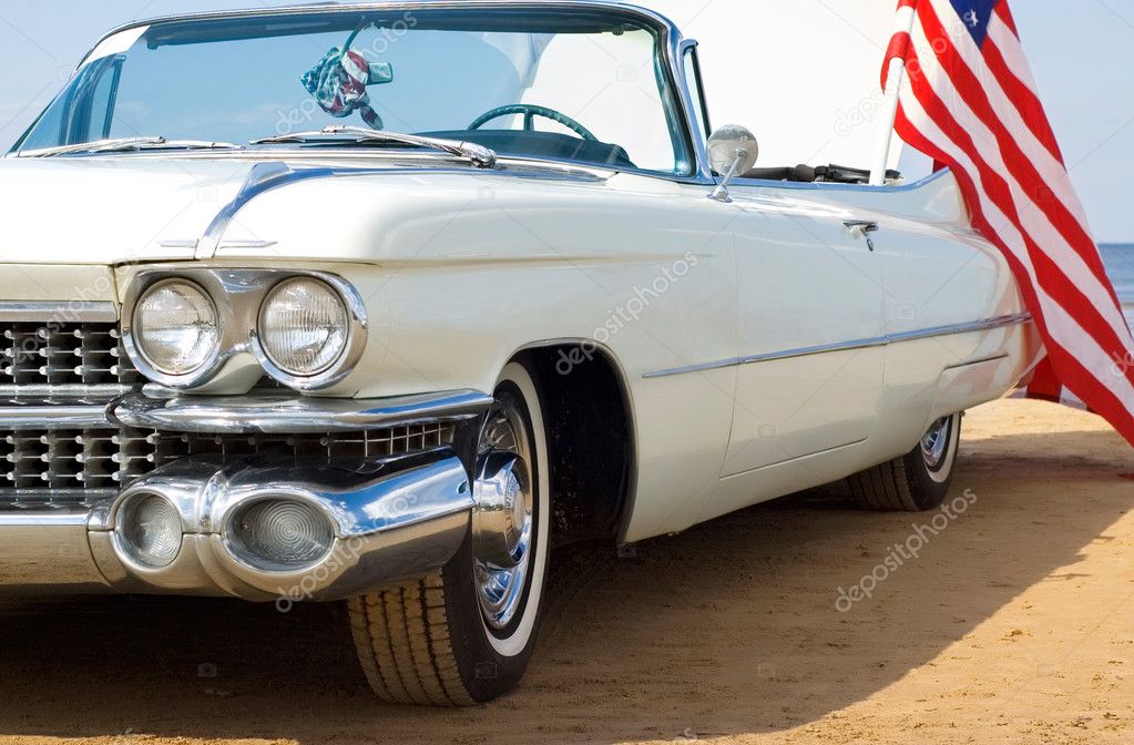 Classic white Cadillac at the beach