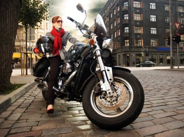 Beautiful woman on the motorcycle clipart