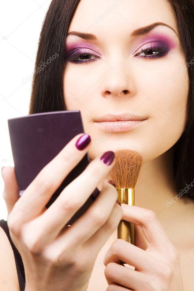 Beautiful young woman with brush