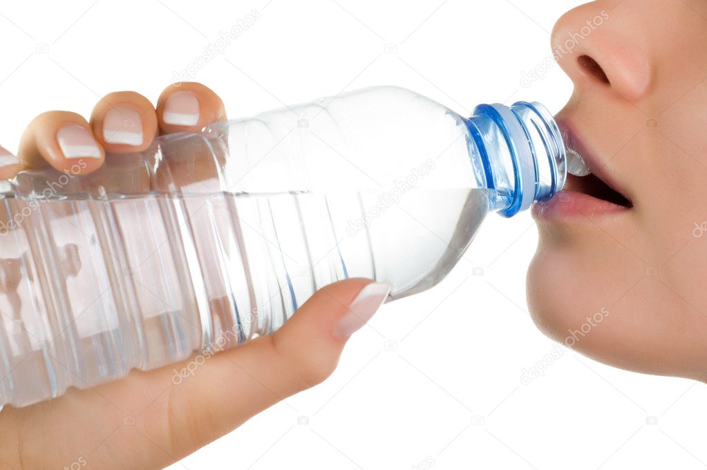 Young girl with bottle of mineral water