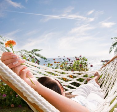 Young woman in hammock clipart