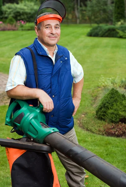 Man with leaf blower — Stock Photo, Image